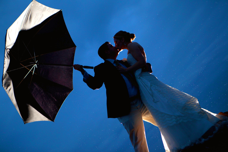 bride and groom with umbrella