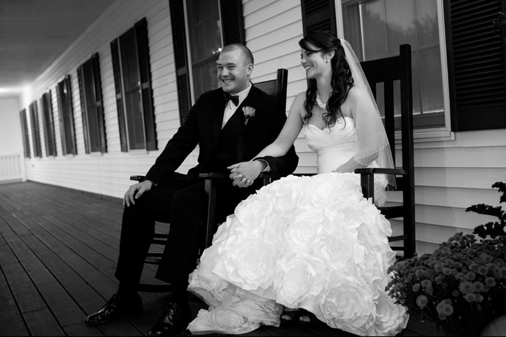 bride and groom on rocking chairs at Groveland Fairways